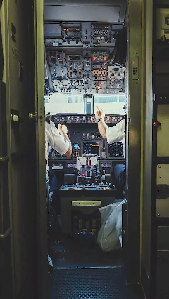 pilot and copilot inside plane cockpit